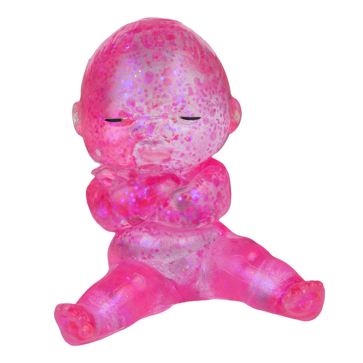Translucent hot pink glitter resin baby figurine sitting with closed eyes and crossed arms
