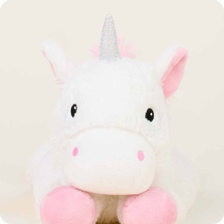 White plush unicorn stuffed animal with silver glitter horn and pink inner ears and hooves