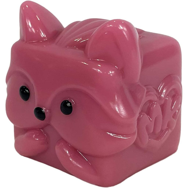 Pink cube-shaped MushyKinz squishy collectible toy with cat ears and black eyes