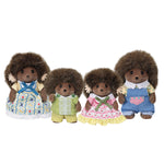 Four Calico Critters hedgehog family figures dressed in colorful fabric outfits on white background