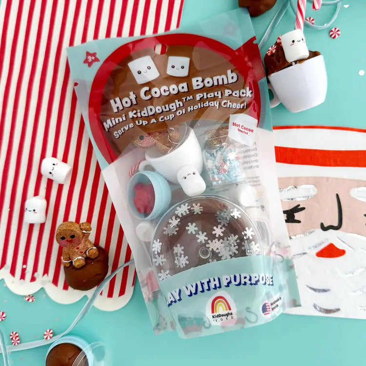 KidDough Hot Cocoa Bomb Mini Play Pack with snowflake mold, marshmallow figurines, and holiday accessories