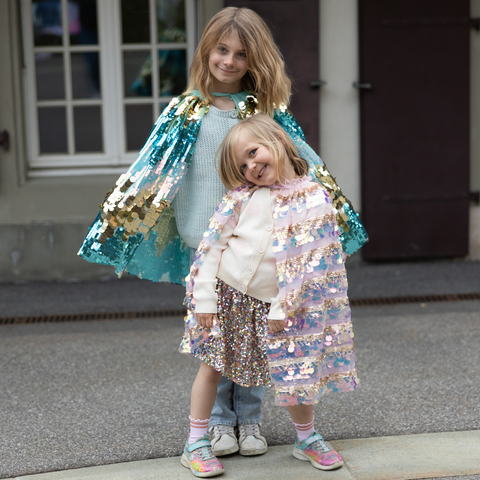Children's light pink cape with iridescent pailette sequins and gold striped detailing