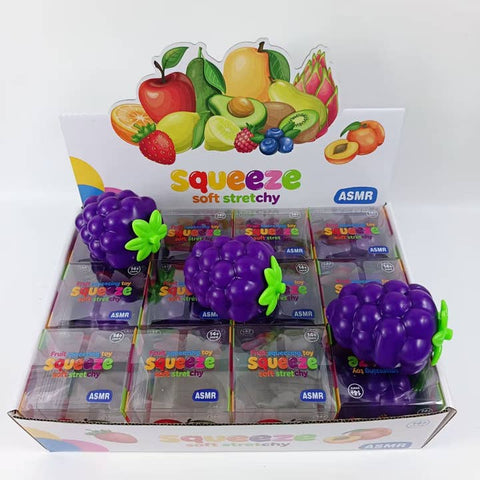 Purple grape-shaped squishy squeeze toys displayed with their clear packaging boxes featuring ASMR branding
