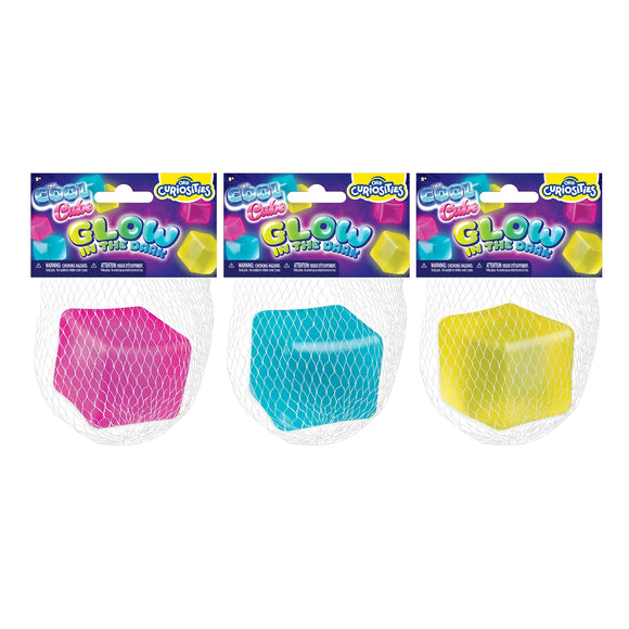 Three Cool Cube Glow in the Dark toys in pink, blue, and yellow mesh packaging