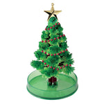 Amazing Grow Christmas Tree toy with crystal green branches, red bead garland, and gold star topper on green base