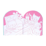 Open cat-themed coloring book with pink polka dot background showing cats at a desk scene