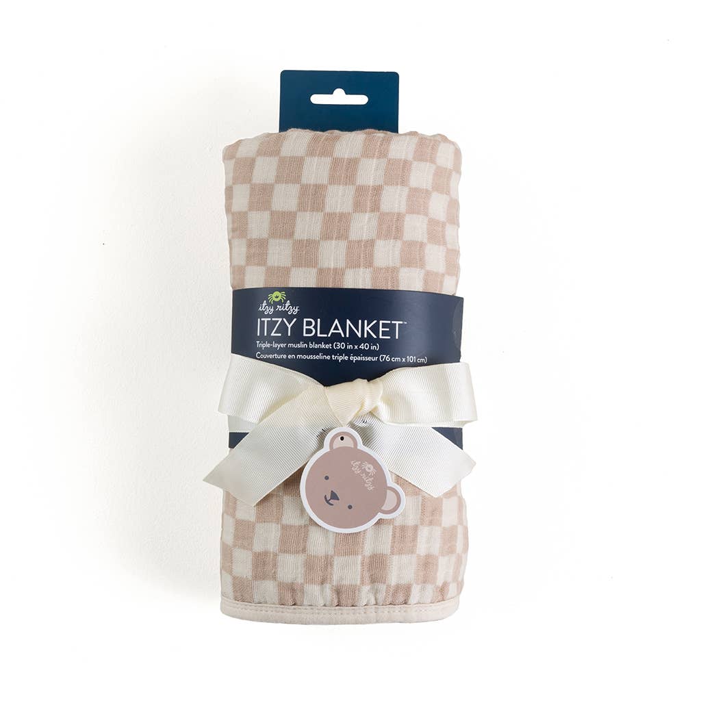 Itzy Ritzy Itzy Blanket in blush checkered pattern, rolled and tied with cream ribbon bow