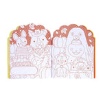 Open Halloween-themed dog coloring book showing dogs in costumes with pumpkins, printed in red and white.