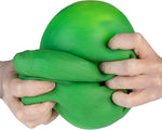 Two hands squeezing and stretching a large green sensory fidget pickle toy