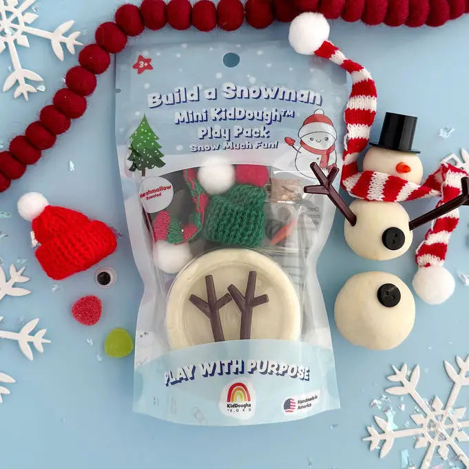 Build a Snowman Mini KidDough Play Pack with white dough, accessories, and assembled snowman example