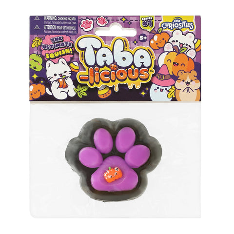 Taba-licious Halloween jack-o-lantern squish toy in clear packaging by ORB Curiosities