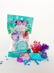 Axolotl Mini Kiddough Play Kit with teal packaging, coral figurines, and colorful axolotl characters