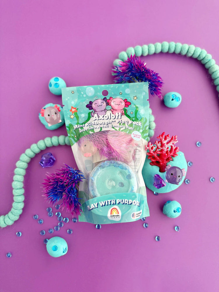 Axolotl Mini KidDough Play Pack displayed on purple background with sensory toys and accessories