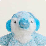 Blue plush penguin stuffed animal with sparkly blue nose and ear muffs on white background