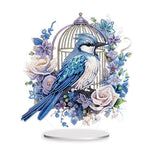 Diamond art tabletop decoration featuring a blue jay bird with floral birdcage design on acrylic stand