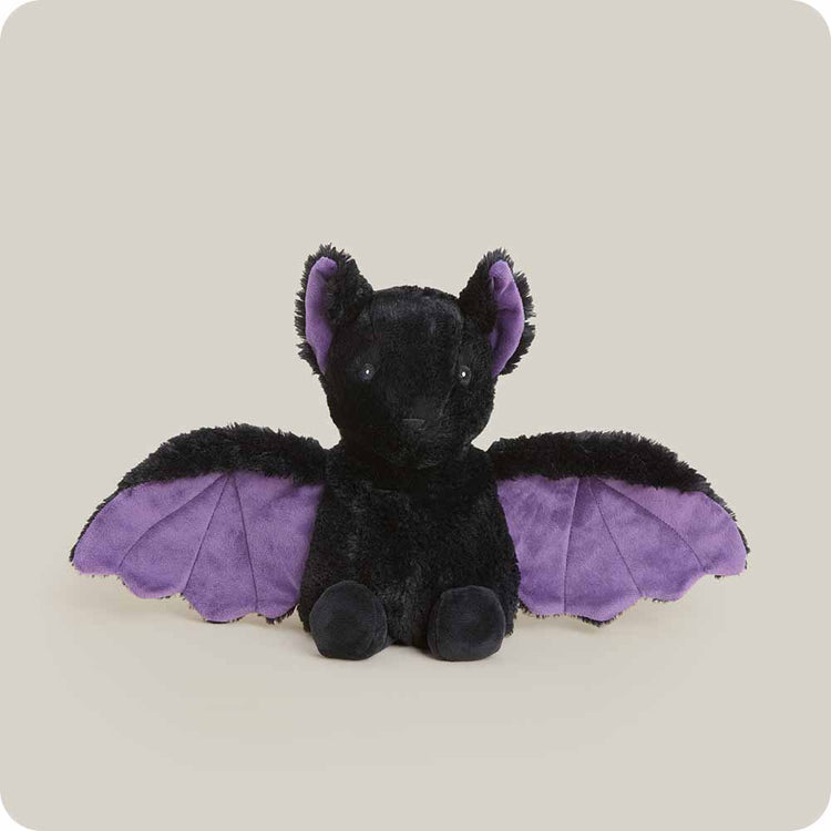 Warmies black plush bat stuffed animal with spread purple wings and ear lining