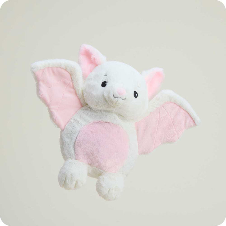 Warmies white bat stuffed animal with pink wings and belly on neutral background