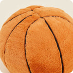 Warmies plush basketball stuffed animal with soft orange fur and black seam lines