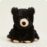 Warmies Junior black bear plush stuffed animal with cream muzzle and paw pads seated upright
