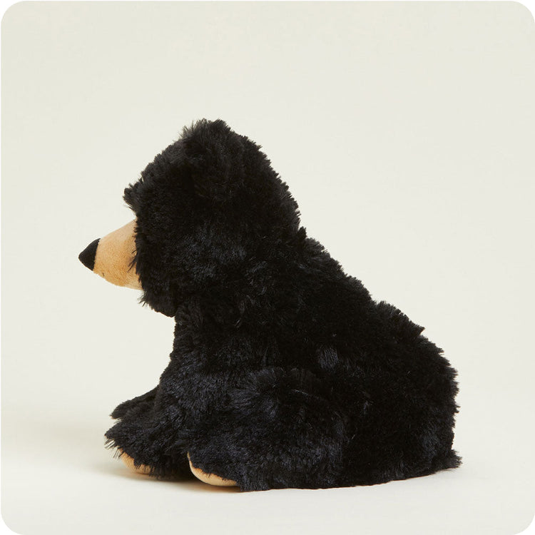 Black bear Warmies Junior plush stuffed animal shown from rear three-quarter view seated position