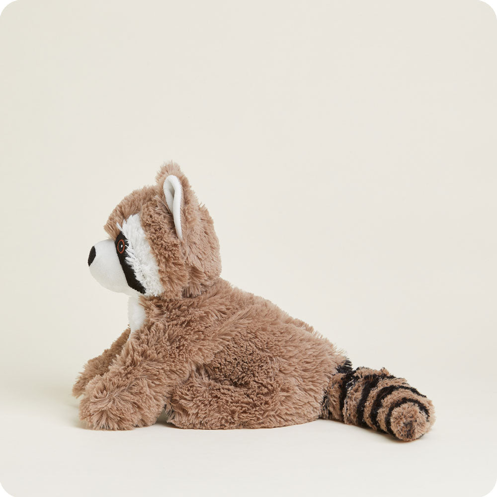 Warmies raccoon stuffed animal with striped tail and classic raccoon markings lying down