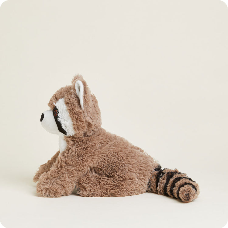 Warmies raccoon stuffed animal with striped tail and classic raccoon markings lying down