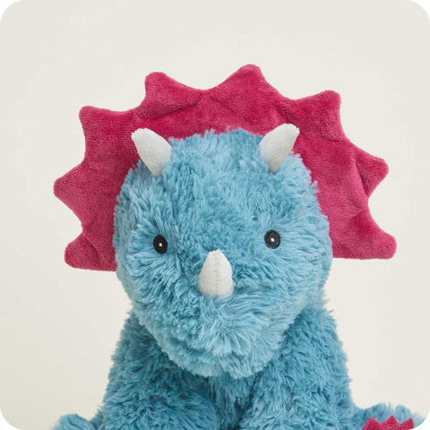 Blue plush triceratops stuffed animal with pink frill, horns, and toe accents sitting upright
