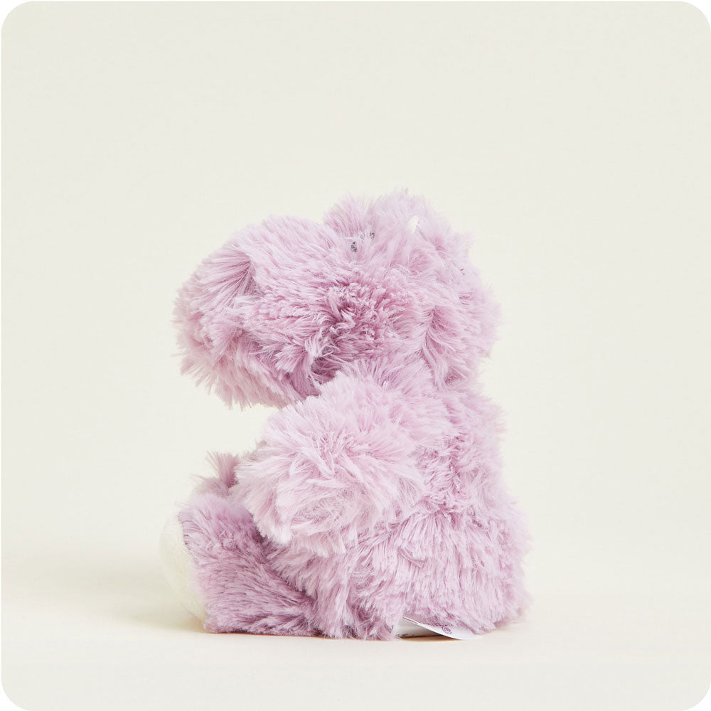 Lavender purple fluffy Warmies Junior Hippo stuffed animal shown from side angle