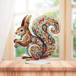 Ornate gemstone squirrel tabletop decoration with colorful paisley diamond painting patterns on display stand