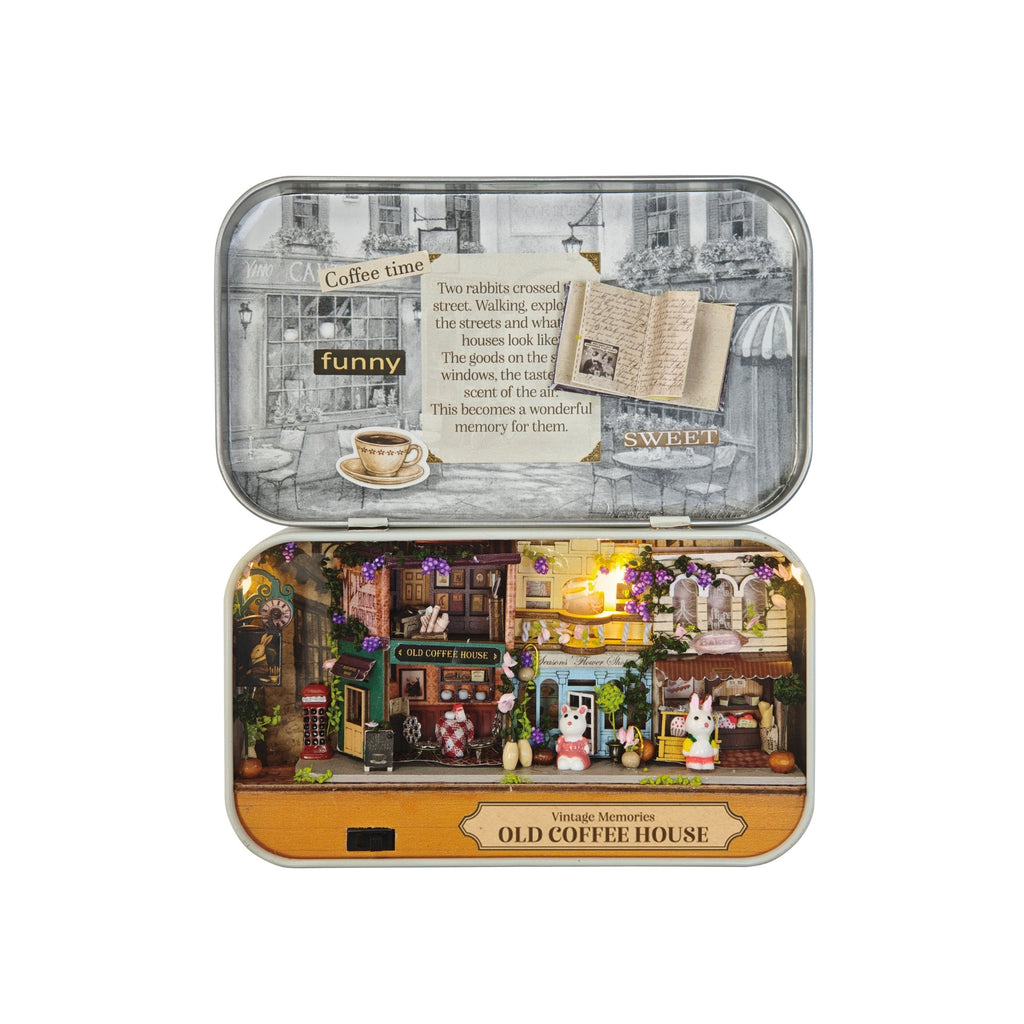 DIY miniature Old Coffee House kit displayed open in decorative tin box with illuminated diorama