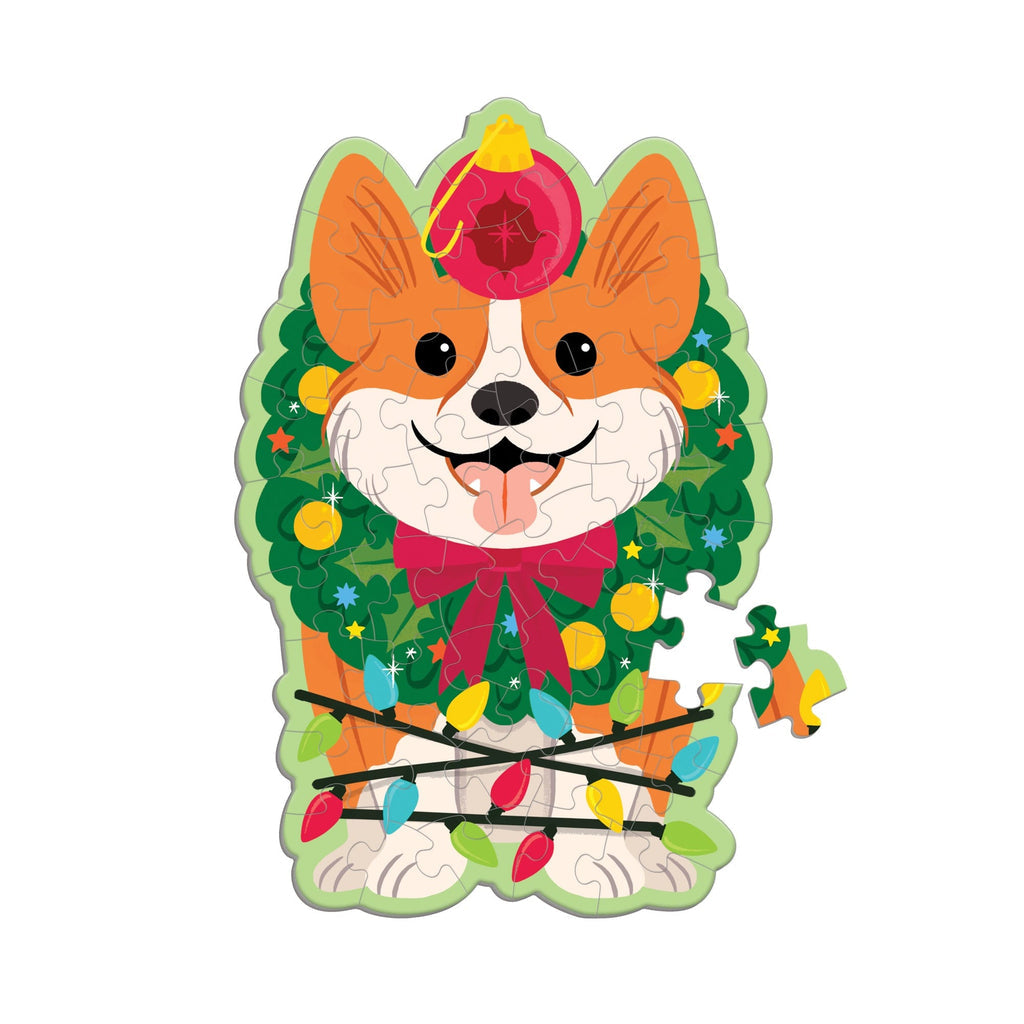 48-piece shaped scratch and sniff puzzle featuring a smiling Christmas corgi with holiday wreath and lights