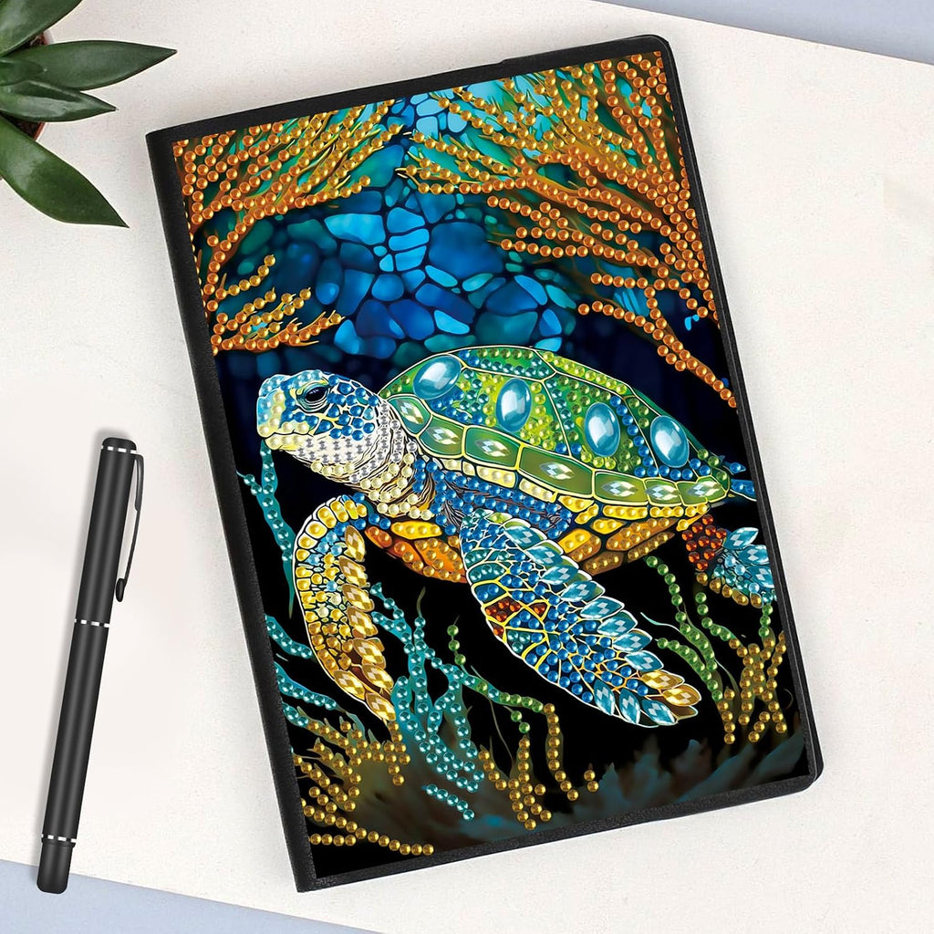 Diamond painting notebook with colorful beaded sea turtle design on black cover
