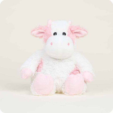 Warmies Strawberry Cow plush stuffed animal with white and pink coloring seated upright