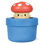 Wooden bath toy mushroom character with red spotted cap sitting in blue pot