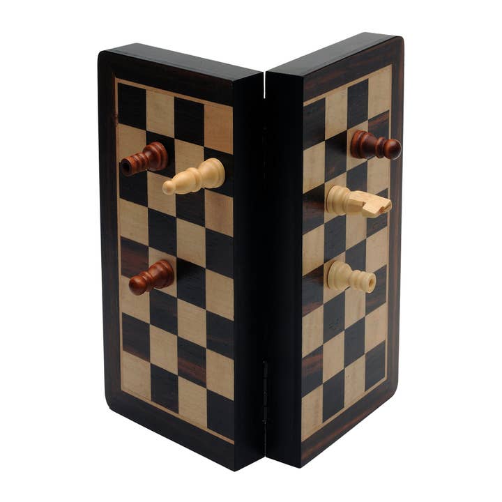 Magnetic folding wooden chess set in black stain with chess pieces attached to board