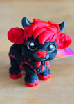 Bonnie Moo-Ras collectible figurine, black and red fantasy baby bull with horns and wings