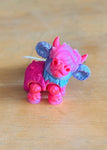 Micro Moos Bubblegum Blitz miniature fantasy cow figure in pink and purple tones