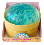 Squish N' Sparkle Dumplin sensory toy with teal glittery dome in yellow container packaging