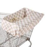 Beige and white checkerboard shopping cart cover with safety buckle installed on metal cart