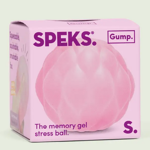 Pink stress ball packaging with 'SPEKS' branding on a light green background