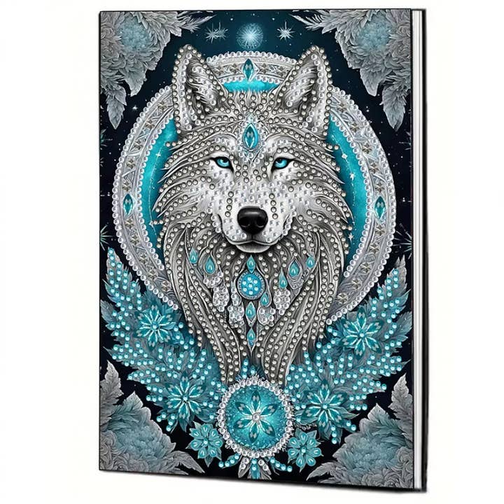 Hardcover notebook featuring ornate diamond-studded celestial wolf design in teal and silver