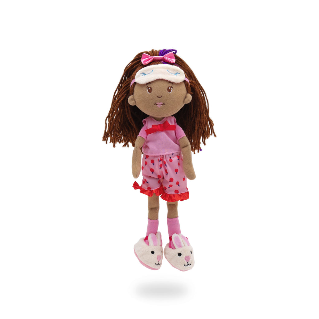 Groovy Girls doll wearing pink polka dot pajamas, sleep mask, and bunny slippers.