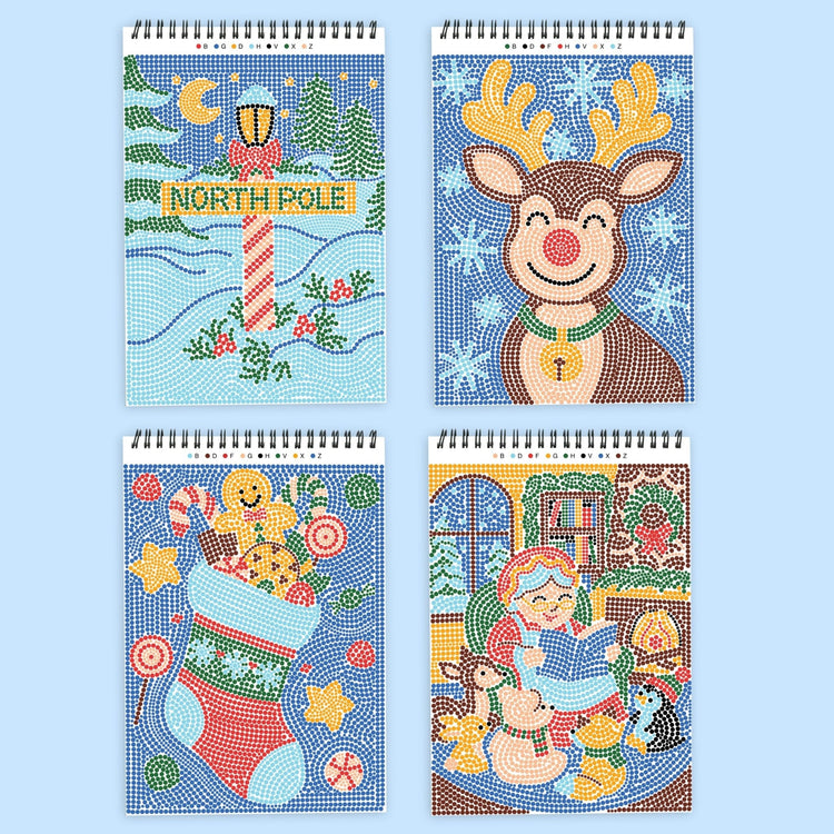 Four spiral-bound dot-by-letter activity notebooks featuring Christmas scenes including North Pole, reindeer, stocking, an...