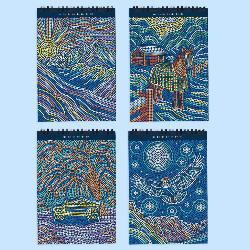 Four spiral-bound FlowArt dot-by-letter notebooks featuring winter-themed metallic mosaic artwork on dark blue covers