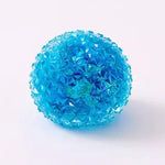 Blue translucent squishy orb with spiky crystal-like texture on white background