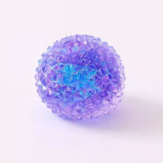 Purple iridescent spiky squishy orb toy with faceted crystal-like texture on white background.