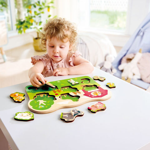 Hape Farmyard Peg Puzzle showing farm animals including pig, cow, horse, donkey, sheep, and chicken