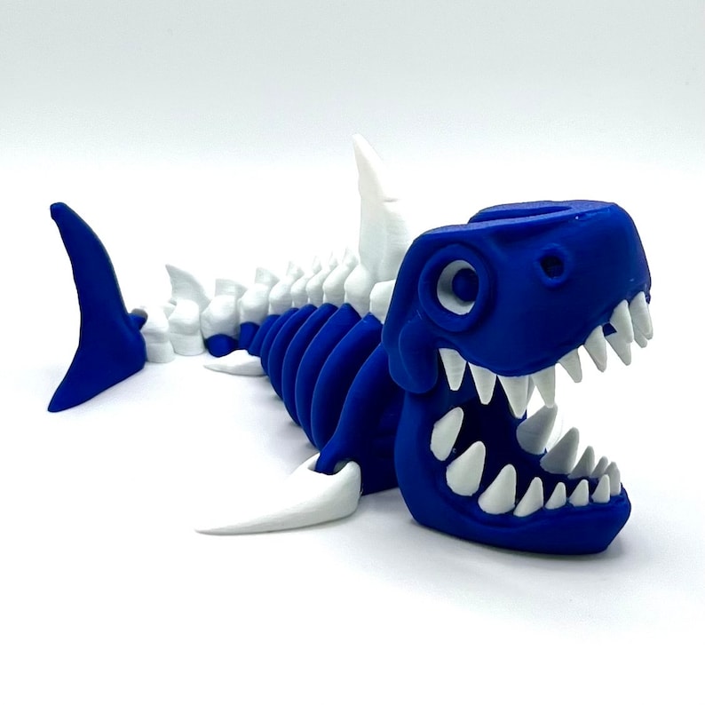 3D printed articulating shark skeleton figurine in blue with white bones and teeth