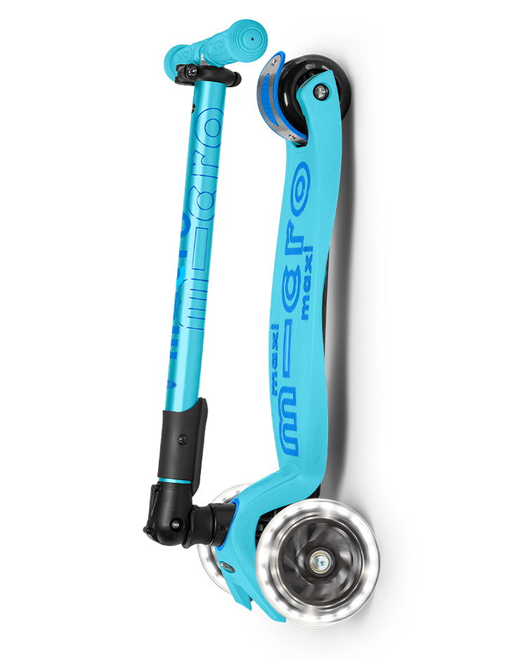 Micro Maxi Deluxe foldable LED scooter in bright blue, shown folded compactly