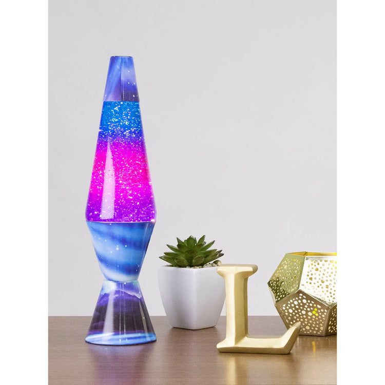 14.5-inch Northern Lights glitter lava lamp with blue base and vibrant pink-purple liquid on wooden shelf